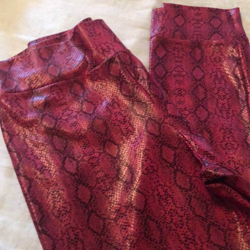 Red snake print fitted pants.